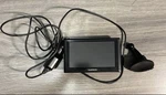 Garmin Gps Navigation System With Charger And Mount Bundle. Fixed Price $40.00.